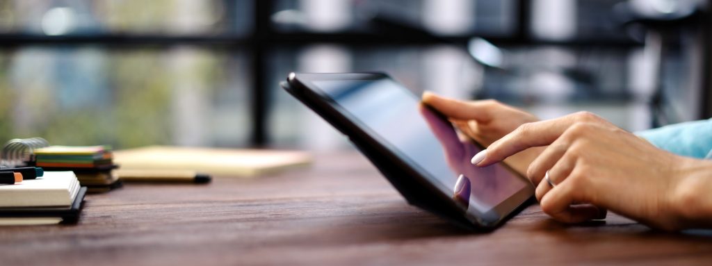 Hands using tablet
